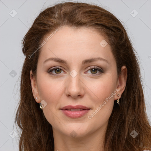 Joyful white young-adult female with long  brown hair and green eyes