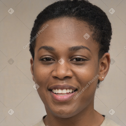 Joyful black young-adult female with short  black hair and brown eyes