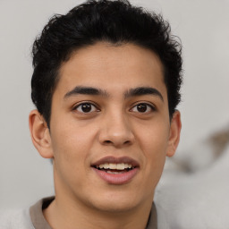 Joyful latino young-adult male with short  brown hair and brown eyes