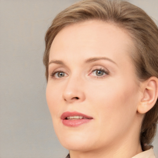 Joyful white young-adult female with medium  brown hair and blue eyes