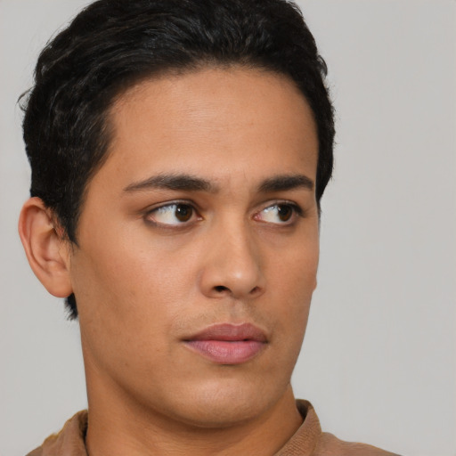 Neutral latino young-adult male with short  brown hair and brown eyes