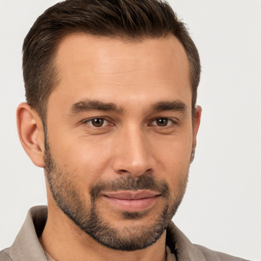 Joyful white young-adult male with short  brown hair and brown eyes