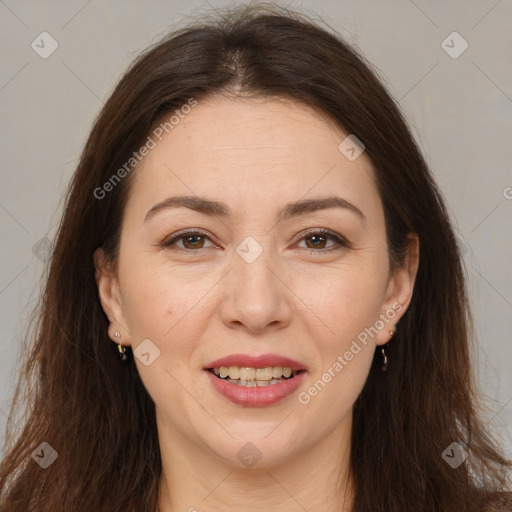 Joyful white adult female with long  brown hair and brown eyes