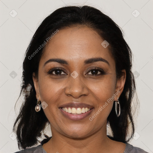 Joyful black young-adult female with medium  brown hair and brown eyes