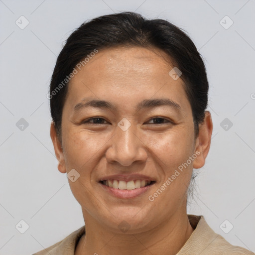 Joyful white adult female with short  brown hair and brown eyes