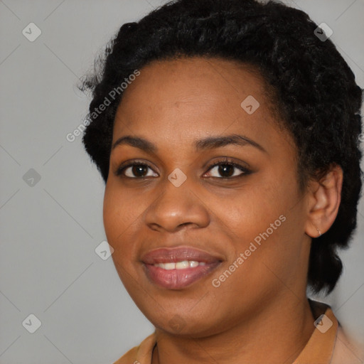 Joyful black young-adult female with short  black hair and brown eyes