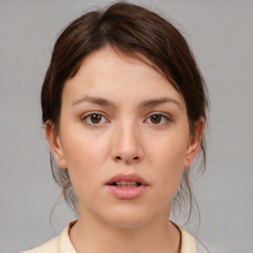 Neutral white young-adult female with medium  brown hair and brown eyes