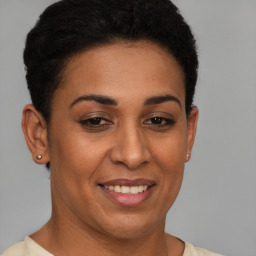 Joyful latino young-adult female with short  brown hair and brown eyes