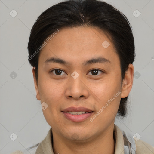 Joyful asian young-adult male with short  brown hair and brown eyes