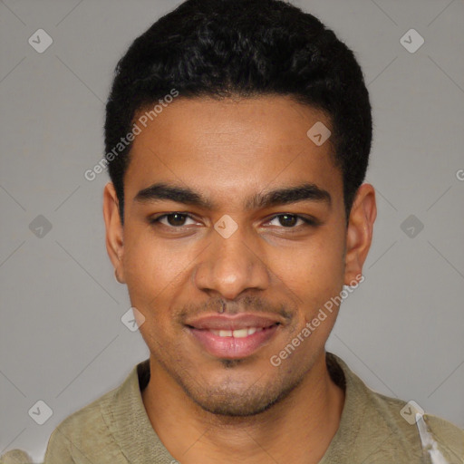 Joyful black young-adult male with short  black hair and brown eyes