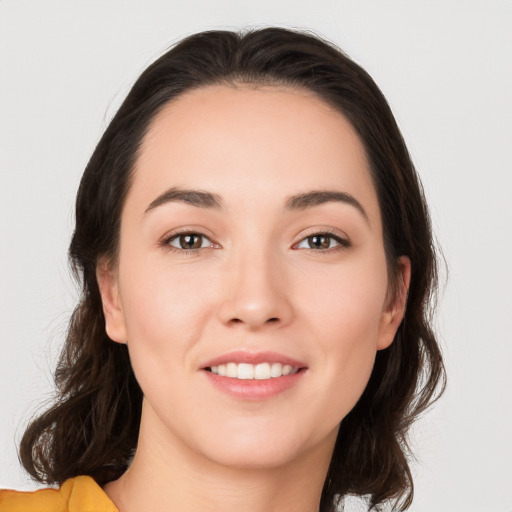 Joyful white young-adult female with medium  brown hair and brown eyes