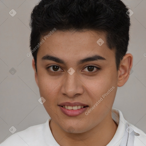 Joyful latino young-adult male with short  brown hair and brown eyes