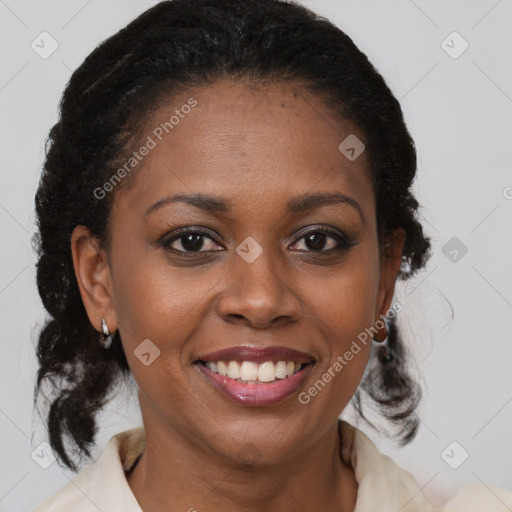 Joyful black young-adult female with medium  brown hair and brown eyes