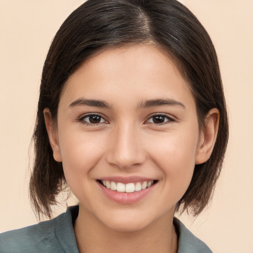 Joyful white young-adult female with medium  brown hair and brown eyes