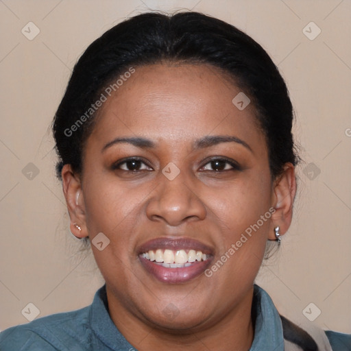 Joyful black adult female with medium  brown hair and brown eyes