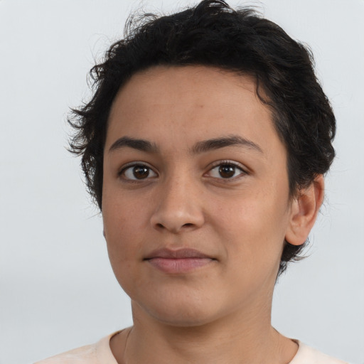Joyful latino young-adult female with short  brown hair and brown eyes
