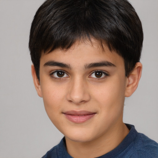 Joyful white child male with short  brown hair and brown eyes