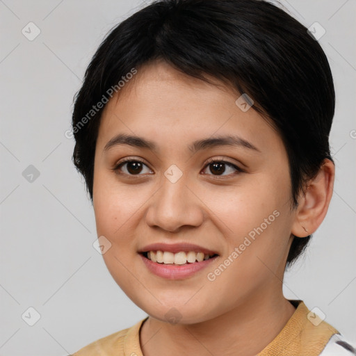 Joyful latino young-adult female with short  brown hair and brown eyes