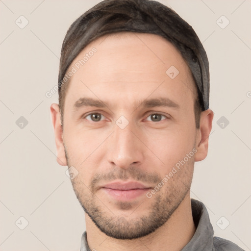 Neutral white young-adult male with short  brown hair and grey eyes