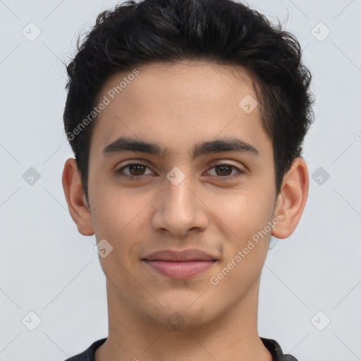 Joyful latino young-adult male with short  brown hair and brown eyes