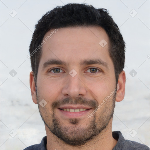 Joyful white young-adult male with short  black hair and brown eyes