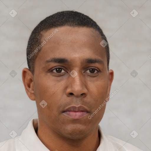 Neutral latino young-adult male with short  brown hair and brown eyes