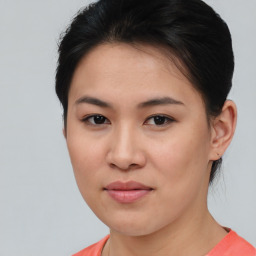 Joyful asian young-adult female with short  brown hair and brown eyes