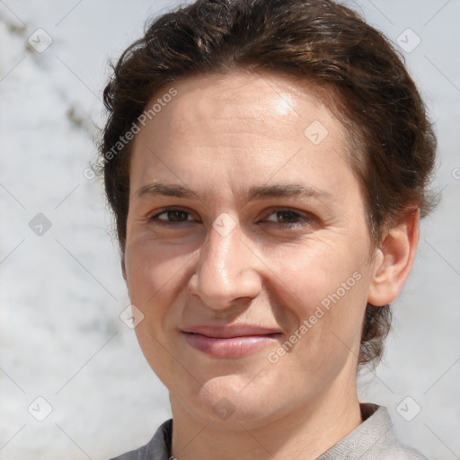 Joyful white adult female with short  brown hair and brown eyes