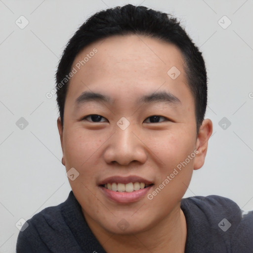 Joyful asian young-adult male with short  black hair and brown eyes