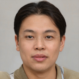 Neutral asian young-adult male with short  brown hair and brown eyes