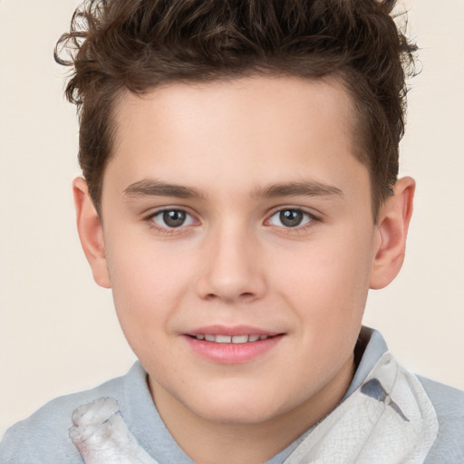 Joyful white child male with short  brown hair and brown eyes