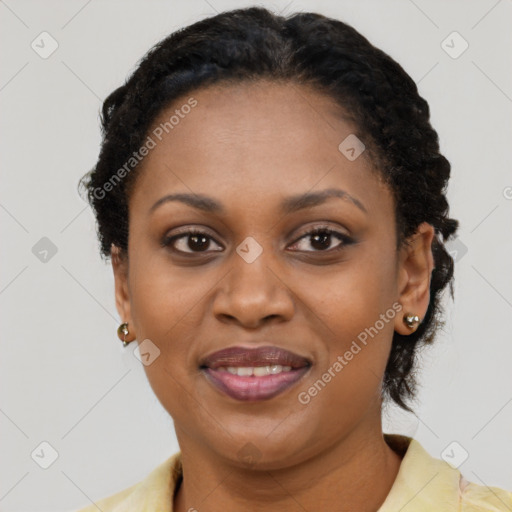 Joyful black adult female with short  black hair and brown eyes