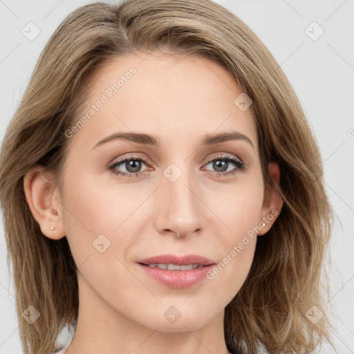 Joyful white young-adult female with long  brown hair and blue eyes