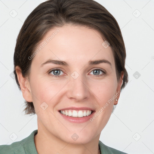 Joyful white young-adult female with short  brown hair and grey eyes