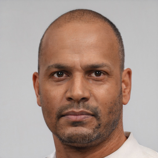 Neutral latino adult male with short  black hair and brown eyes