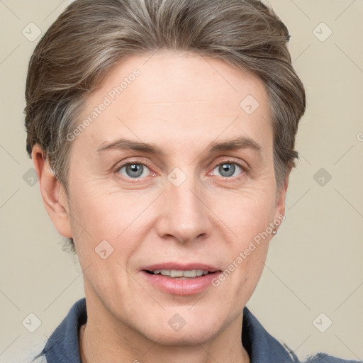 Joyful white adult female with short  brown hair and grey eyes