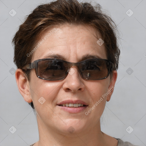 Joyful white adult female with short  brown hair and brown eyes