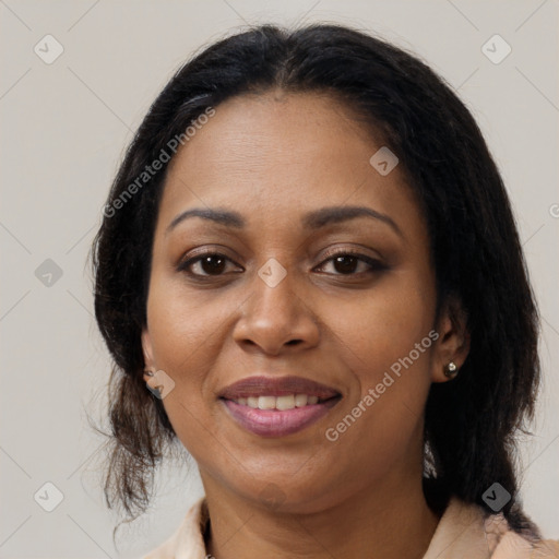 Joyful black adult female with medium  brown hair and brown eyes