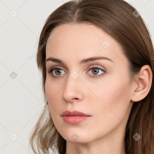 Neutral white young-adult female with long  brown hair and brown eyes