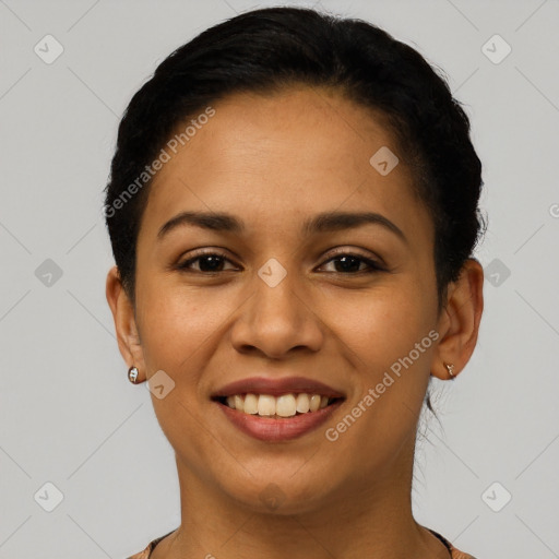 Joyful latino young-adult female with short  brown hair and brown eyes