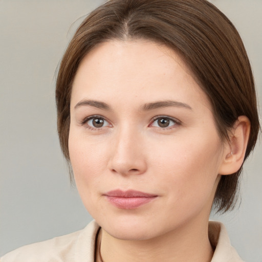 Neutral white young-adult female with medium  brown hair and brown eyes