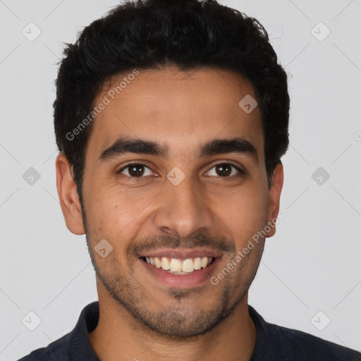 Joyful latino young-adult male with short  brown hair and brown eyes