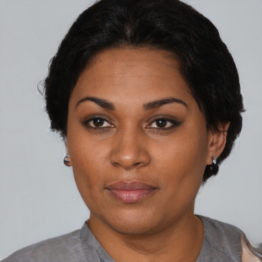 Neutral black young-adult female with short  black hair and brown eyes