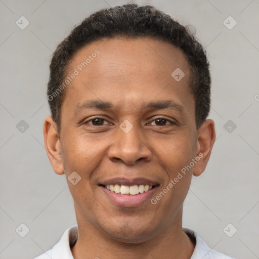 Joyful latino young-adult male with short  brown hair and brown eyes