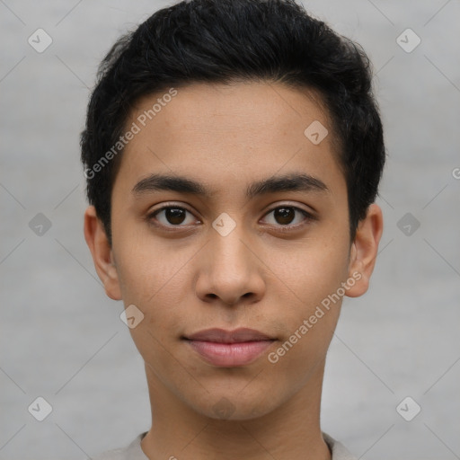 Joyful latino young-adult male with short  brown hair and brown eyes