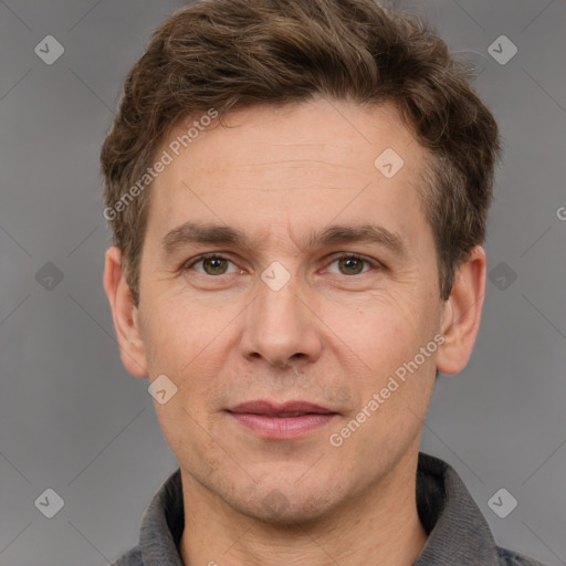 Joyful white adult male with short  brown hair and grey eyes