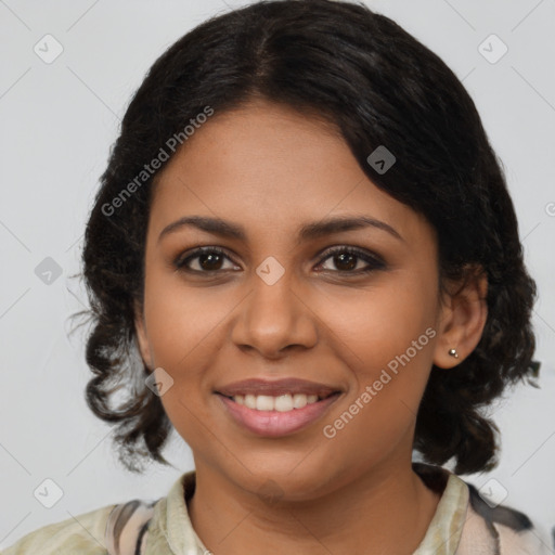 Joyful black young-adult female with medium  brown hair and brown eyes