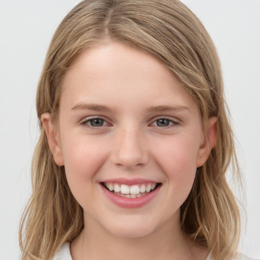 Joyful white child female with medium  brown hair and grey eyes