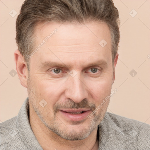 Joyful white adult male with short  brown hair and grey eyes