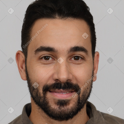 Joyful white young-adult male with short  black hair and brown eyes